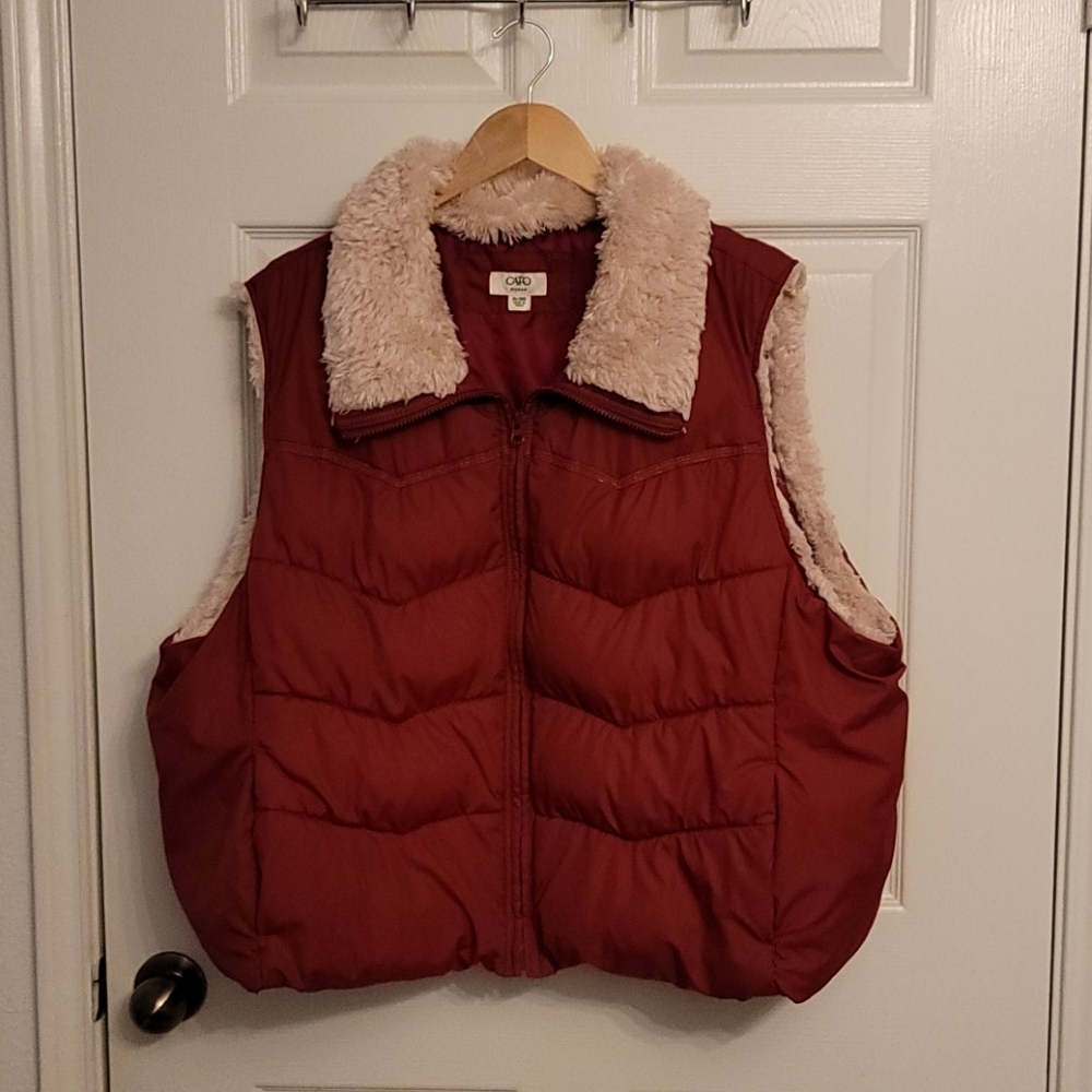 Burgundy puffy best with fur collar.